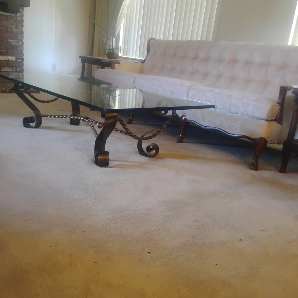 Elegant Glass Coffee Table with Black Metal Accents